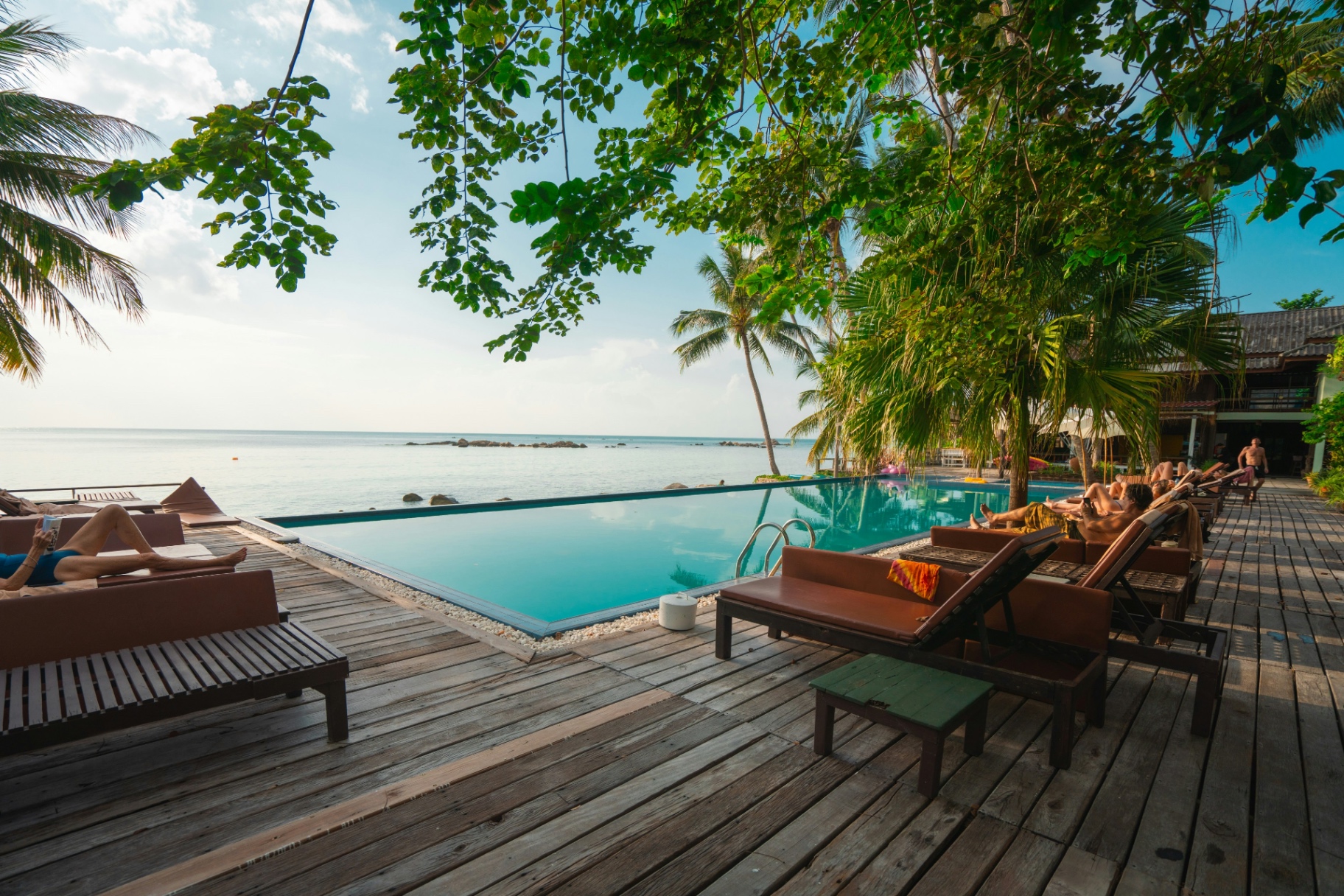 Beach club lounge with umbrellas on the sand